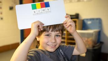 Boy with learning tool.