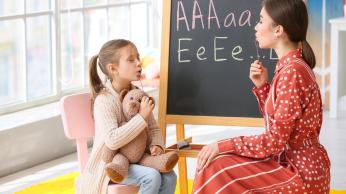 Woman with child, learning oral language.