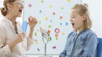 Woman and student practicing oral language