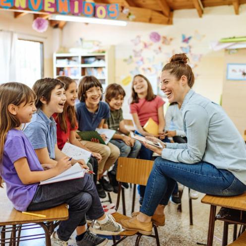 Students laughing with teacher