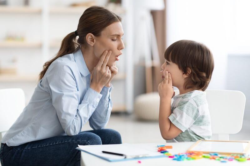 Teacher and student practicing oral language