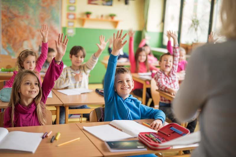 kids raising hands