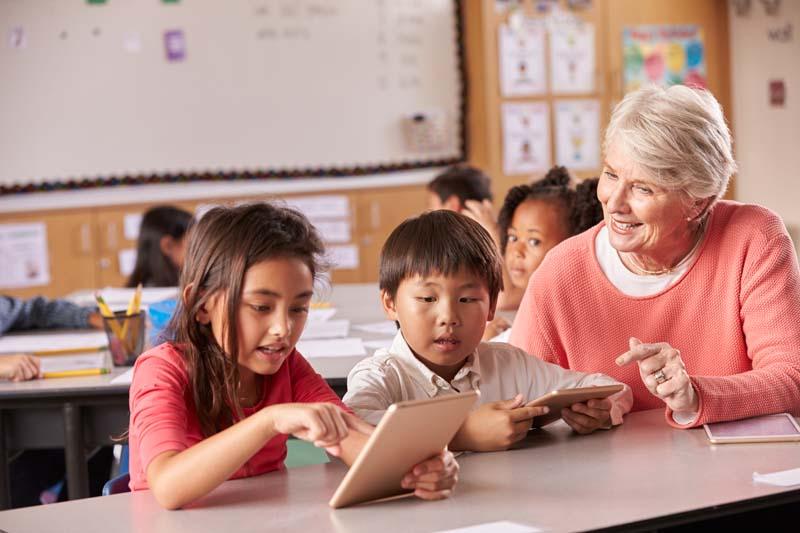 teacher with two kids learning