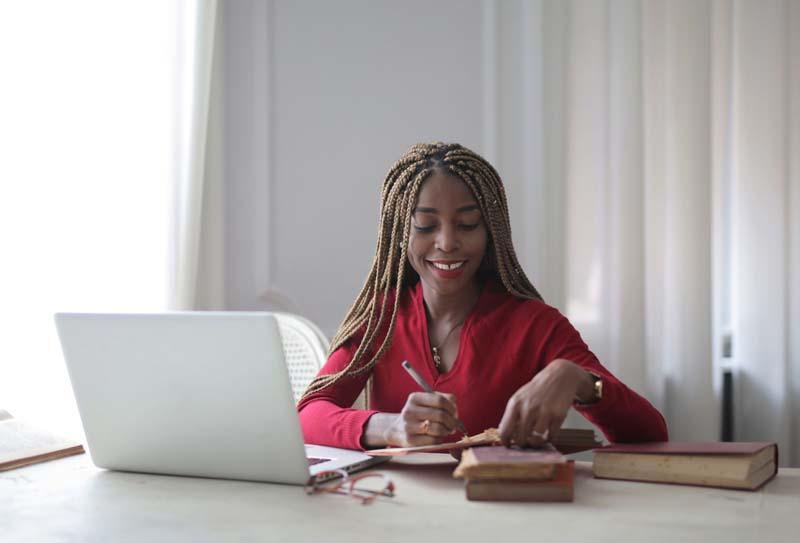 woman-sitting-in-front-of-laptop