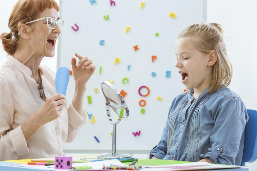 Woman and student practicing oral language